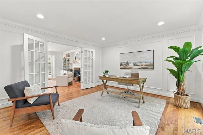 Hardwood flooring, recessed lighting, decorative crown molding, and wainscoting — 2785 Sun Meadow Drive, Wildwood, MO 63005