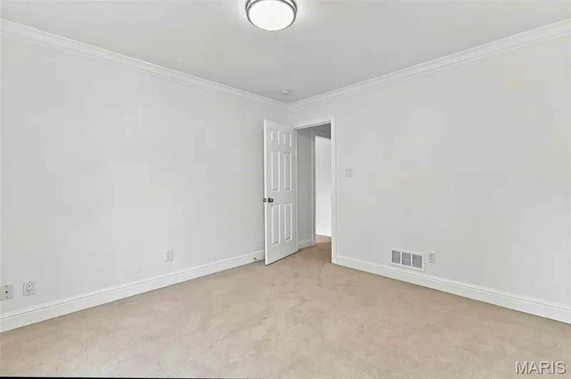 Neutral wall color with crown molding — 2785 Sun Meadow Drive, Wildwood, MO 63005