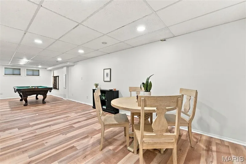 Recessed lighting illuminates the wood-finish flooring — 2785 Sun Meadow Drive, Wildwood, MO 63005