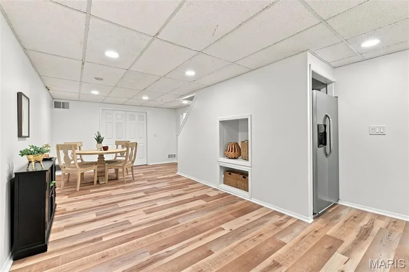 Wood-finish flooring, recessed lighting, and a built-in refrigerator — 2785 Sun Meadow Drive, Wildwood, MO 63005