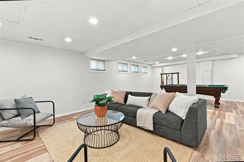 Recessed lighting, wood-finish flooring, drop ceiling, and multiple windows — 2785 Sun Meadow Drive, Wildwood, MO 63005