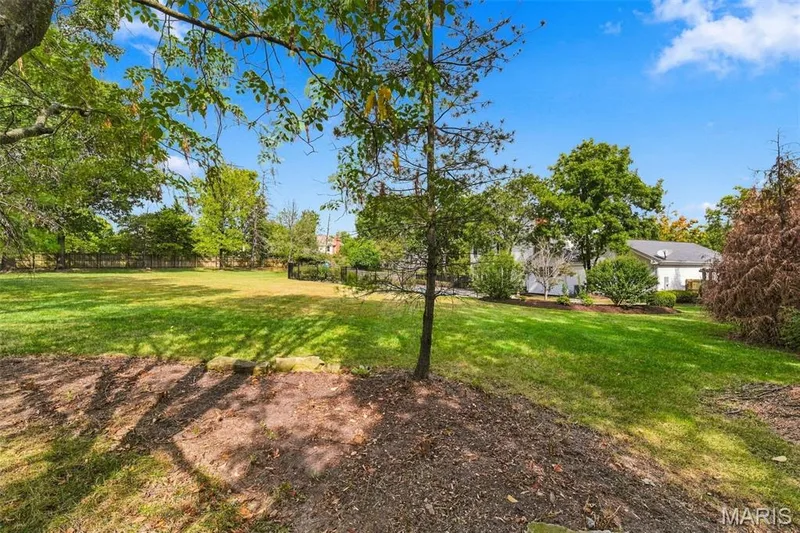 Expansive lawn area with mature trees and established landscaping — 2785 Sun Meadow Drive, Wildwood, MO 63005