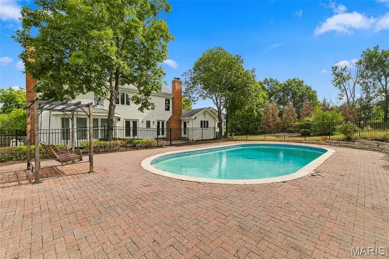 Expansive brick paver patio with an in-ground swimming pool — 2785 Sun Meadow Drive, Wildwood, MO 63005