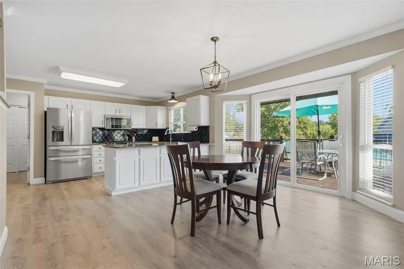 Breakfast Area adjoins Kitchen, Staircase, Hearth Room, and has sliding glass doors to rear deck. — 386 Beckley Place, St Charles, MO 63304