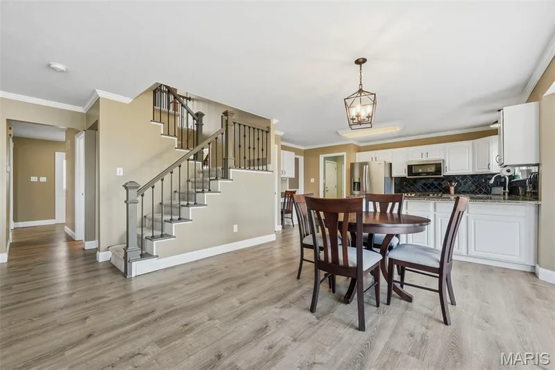 Breakfast Area adjoins Kitchen, Staircase, Hearth Room, and has sliding glass doors to rear deck. — 386 Beckley Place, St Charles, MO 63304