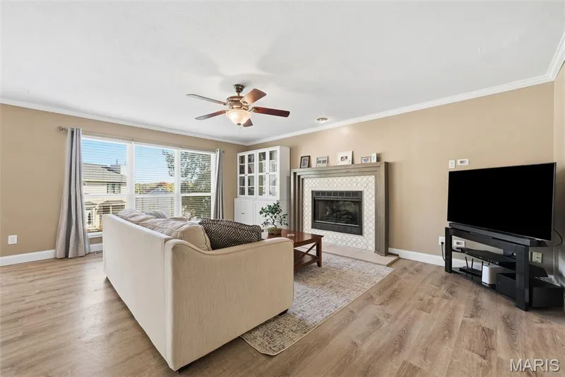 Hearth Room with gas fireplace adjoins Breakfast Area and Living Room. — 386 Beckley Place, St Charles, MO 63304