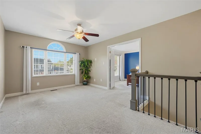 Upstairs Family Room adjoins Primary Suite, secondary bedrooms 2-4, and Hall Bath. — 386 Beckley Place, St Charles, MO 63304