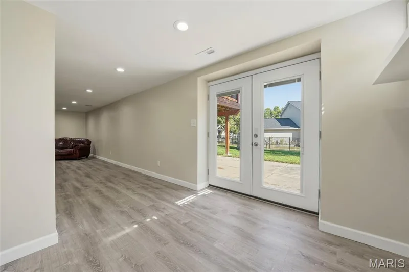Lower-Level walk out to rear patio, covered patio, and backyard. — 386 Beckley Place, St Charles, MO 63304