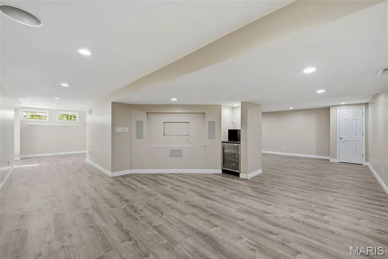 Lower-Level Media/TV Area with surround sound and undercounter beverage cooler. Adjoins Rec Room and Office. — 386 Beckley Place, St Charles, MO 63304