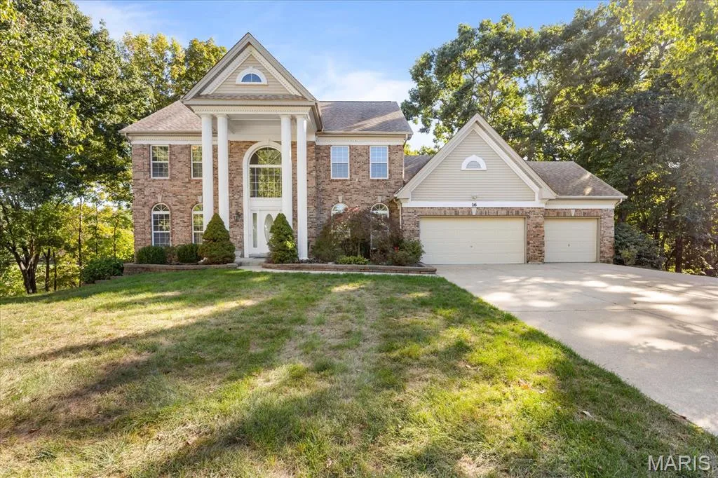 Front of Home - Large driveway with 3 car garage — 16 Regatta Bay Court, Lake St. Louis, MO 63367