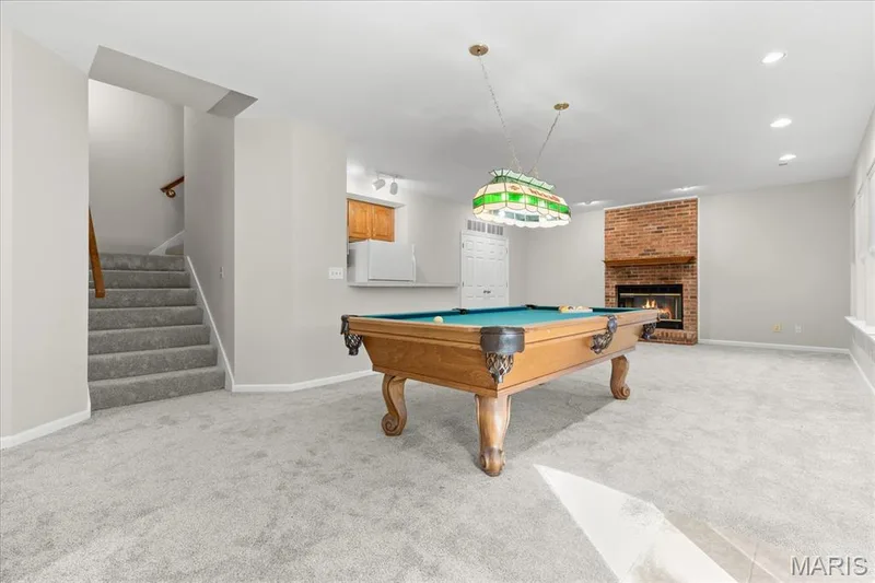 Recreation room with another fireplace — 16 Regatta Bay Court, Lake St. Louis, MO 63367