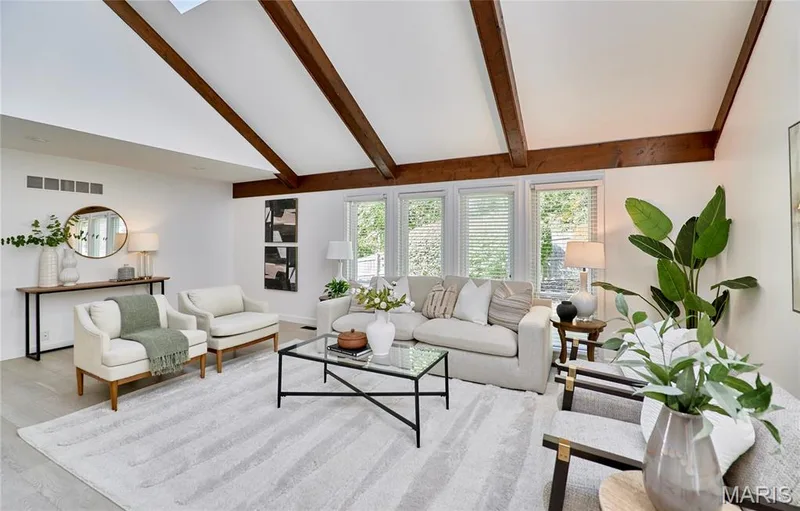 Vaulted ceilings with exposed beams, light wood-finish flooring, recessed lighting, and multiple windows with horizontal blinds — 1843 Shadywood Court, Chesterfield, MO 63017