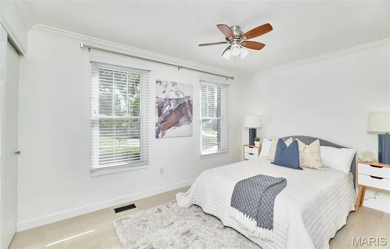 Wood-finish flooring with crown molding and two windows with blinds — 1843 Shadywood Court, Chesterfield, MO 63017