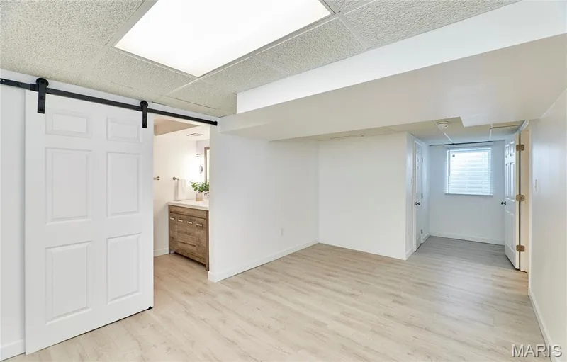 Lower level bedroom suite with luxury vinyl  flooring throughout — 1843 Shadywood Court, Chesterfield, MO 63017