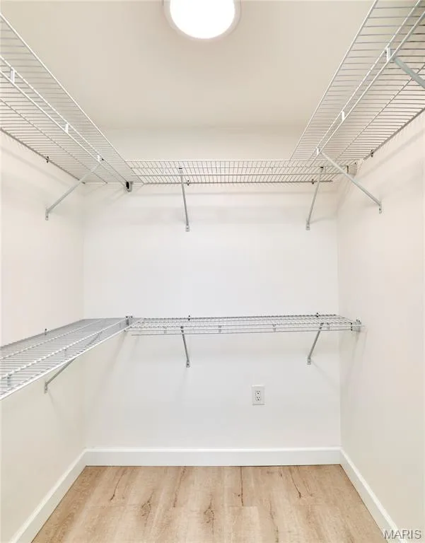 White wire shelving system, recessed ceiling light, wood-finish flooring — 1843 Shadywood Court, Chesterfield, MO 63017