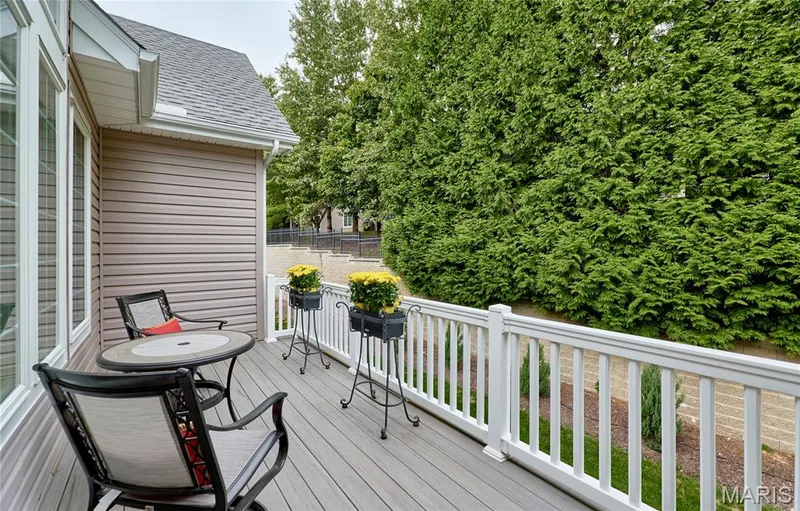 Outdoor deck with composite decking, white railing, and horizontal siding — 1970 Chesterfield Ridge Circle, Chesterfield, MO 63017