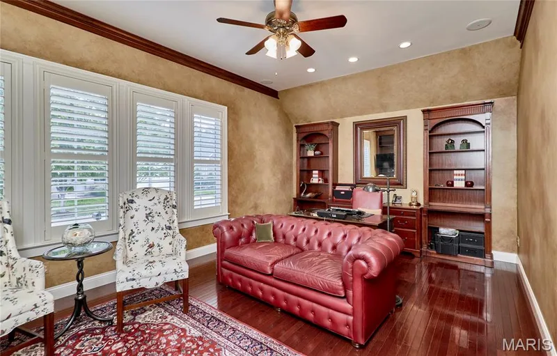 Hardwood flooring, crown molding, plantation shutters, recessed lighting, and a ceiling fan with integrated lighting — 1970 Chesterfield Ridge Circle, Chesterfield, MO 63017