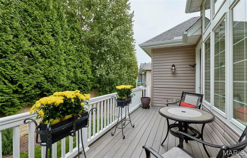 Spacious composite deck with white railing, exterior wall siding, and large multi-pane windows — 1970 Chesterfield Ridge Circle, Chesterfield, MO 63017