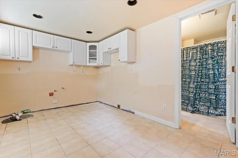 The laundry located off the full bath in the basement — 1353 Osage Meadows Drive, O'Fallon, MO 63366