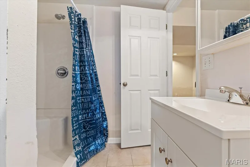 A full bath is in the basement perfect if you have guests.  New vanity and new toilet. — 1353 Osage Meadows Drive, O'Fallon, MO 63366