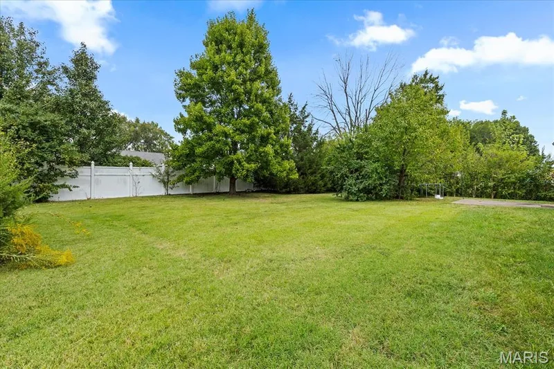 Large fenced in backyard is great for kids to play or dogs to run. — 1353 Osage Meadows Drive, O'Fallon, MO 63366