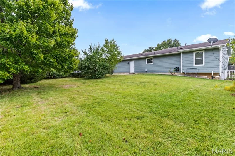 There is a walk-out located to the right of the home. — 1353 Osage Meadows Drive, O'Fallon, MO 63366