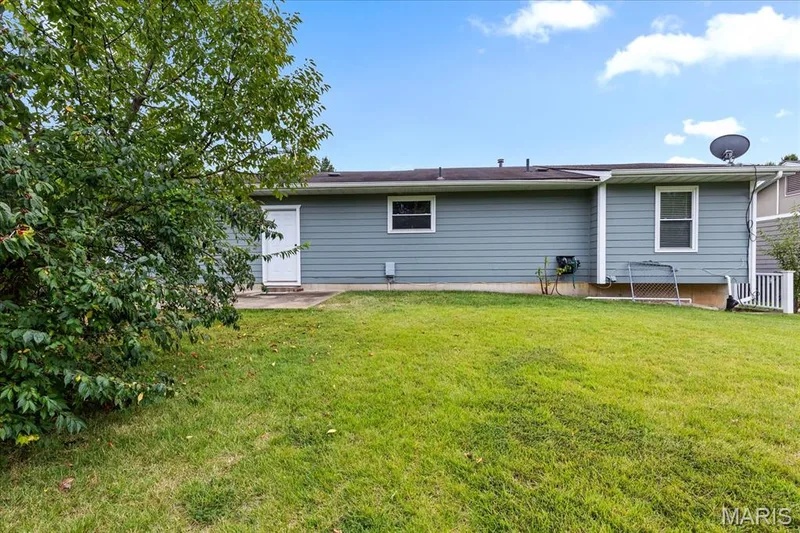 A patio off the back perfect for grilling or just sitting outside enjoying the large yard. — 1353 Osage Meadows Drive, O'Fallon, MO 63366