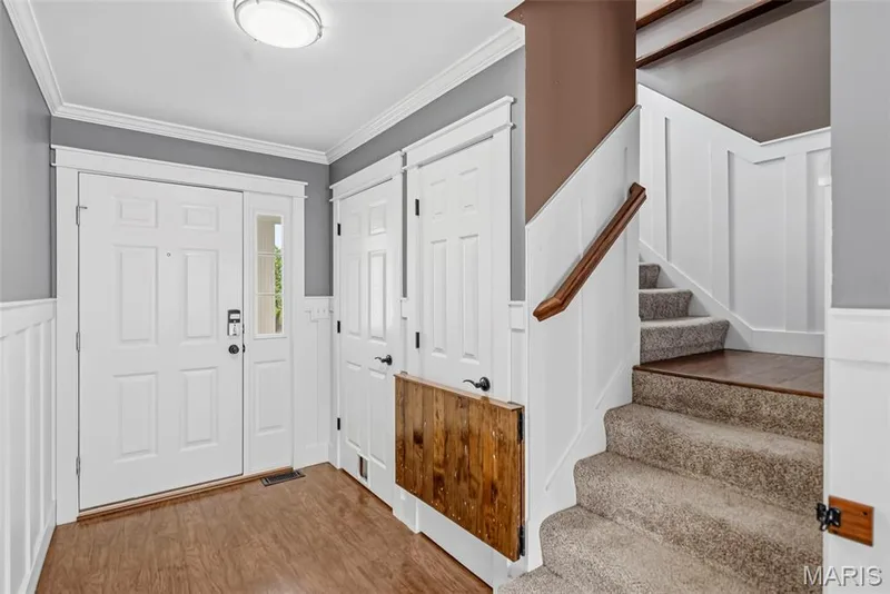 Entrance with beautiful wainscoting — 242 Ashford Oaks Drive, Wentzville, MO 63385