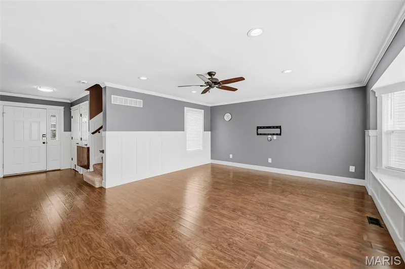 Living room with recess lighting an ceiling fan — 242 Ashford Oaks Drive, Wentzville, MO 63385