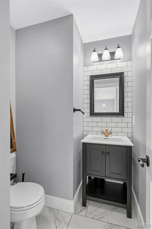 Main level updated half bath — 242 Ashford Oaks Drive, Wentzville, MO 63385
