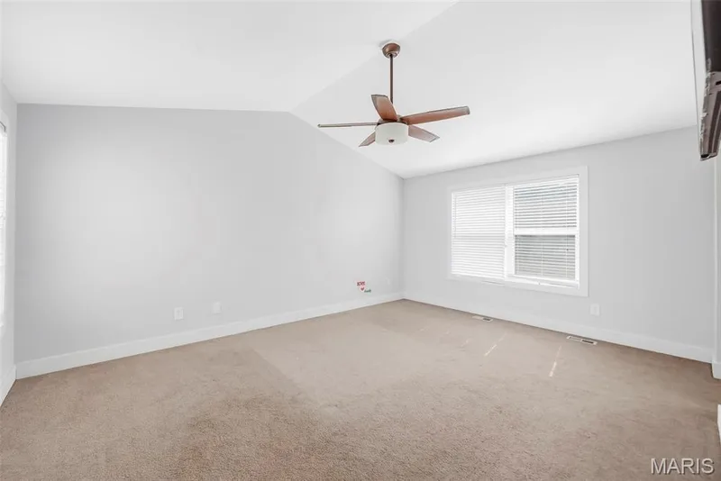 Primary bedroom with front and back yard views — 242 Ashford Oaks Drive, Wentzville, MO 63385