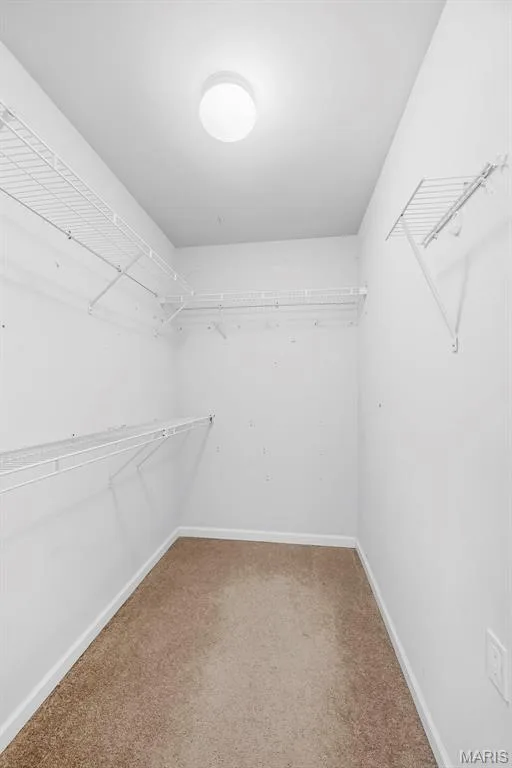 Primary walk in closet — 242 Ashford Oaks Drive, Wentzville, MO 63385