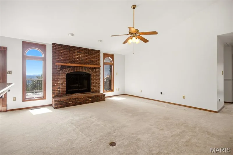 With wood burning brick facade fireplace. — 2 Rockwood Forest Glen, Wildwood, MO 63025