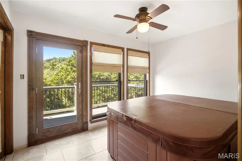 Office (with deck access) currently being used as a hot tub room.  Hot tub is believed to work but being sold as-is. — 2 Rockwood Forest Glen, Wildwood, MO 63025