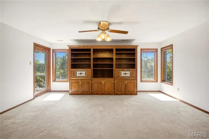 Lower level family room with built-ins and deck access. — 2 Rockwood Forest Glen, Wildwood, MO 63025