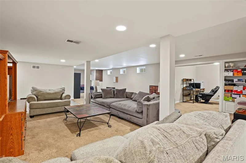 Recessed lighting illuminates this expansive lower-level space, featuring carpet — 521 Sceptre Road, Wentzville, MO 63385