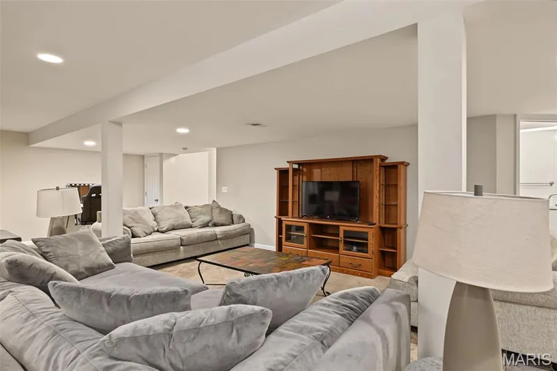 Recessed lighting illuminates this expansive lower-level space, featuring carpet and carpeted flooring — 521 Sceptre Road, Wentzville, MO 63385