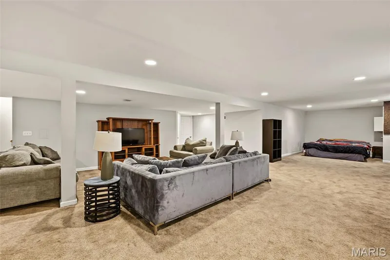 Recessed lighting illuminates this expansive lower-level space, featuring carpet — 521 Sceptre Road, Wentzville, MO 63385