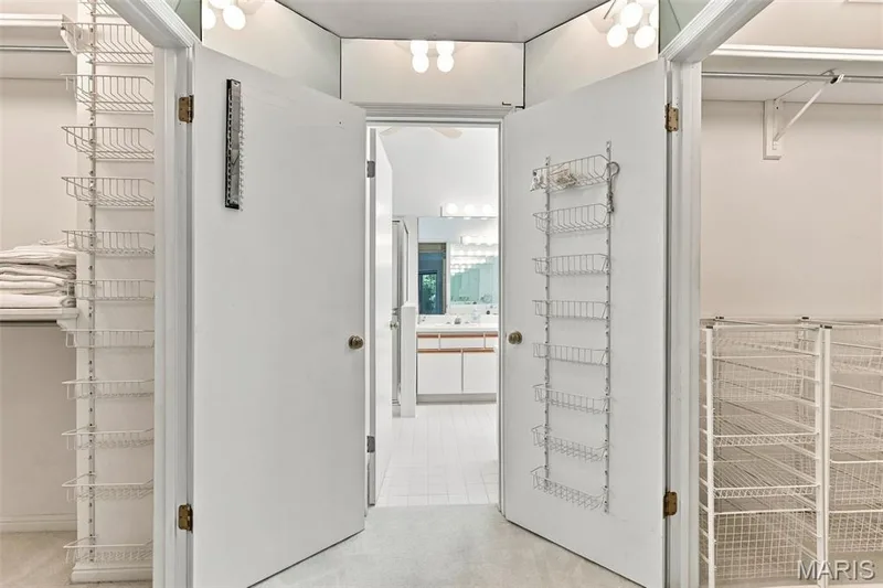 Like Closets? TWO walk-in, decked-out closets off the Mirrored dressing area — 14033 Baywood Villages Drive, Chesterfield, MO 63017