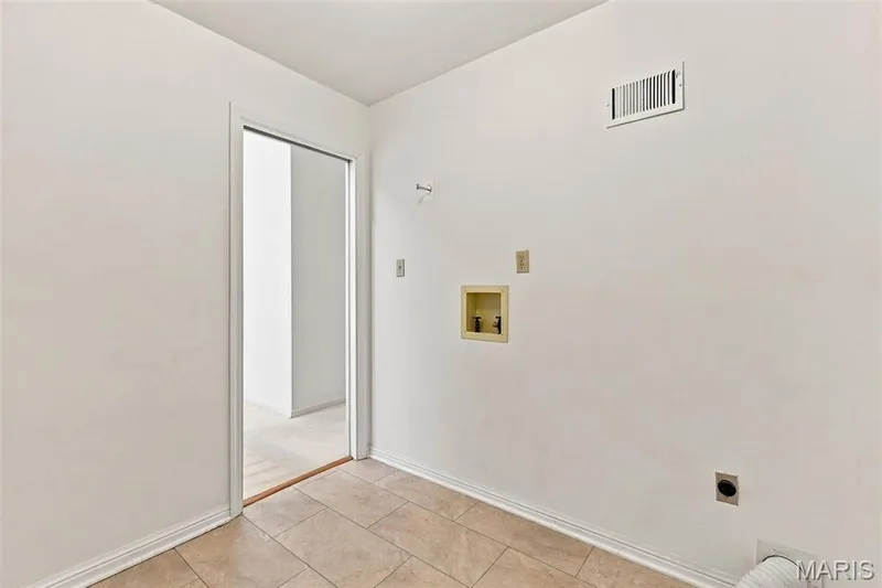 Laundry Room with closet and built-in Ironing Board — 14033 Baywood Villages Drive, Chesterfield, MO 63017