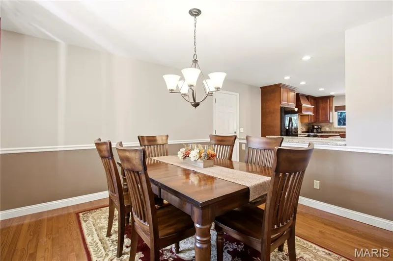 Dining room open to the kitchen — 733 Cedar Glen Drive, Weldon Spring, MO 63304