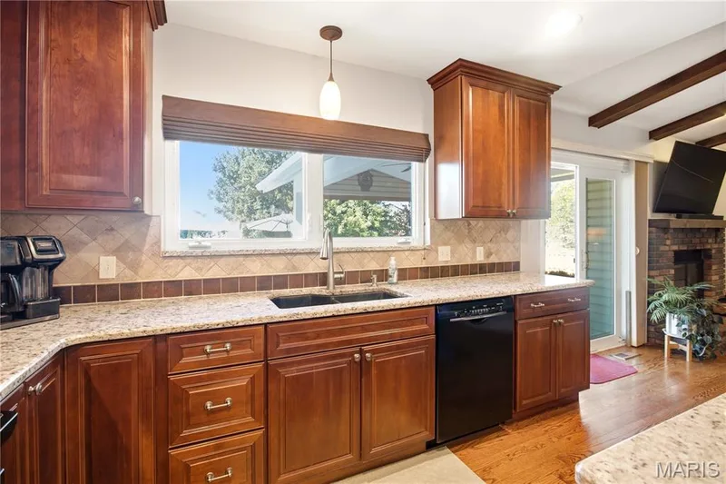 Doing dishes with a view of the gorgeous backyard — 733 Cedar Glen Drive, Weldon Spring, MO 63304