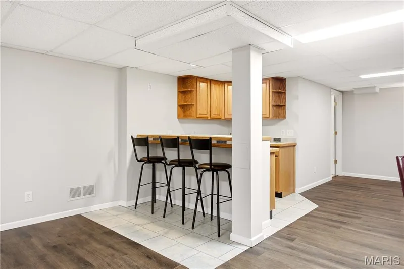 Wet bar with more seating — 733 Cedar Glen Drive, Weldon Spring, MO 63304