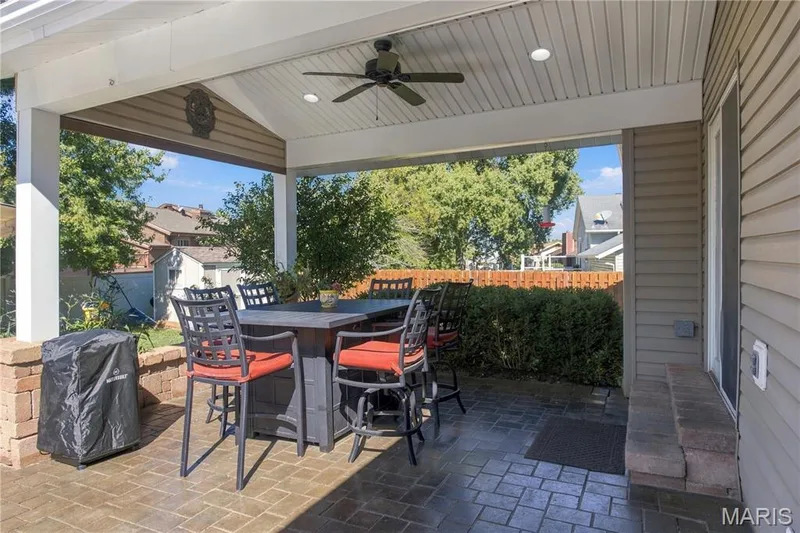 Covered back patio with ceiling fan — 733 Cedar Glen Drive, Weldon Spring, MO 63304