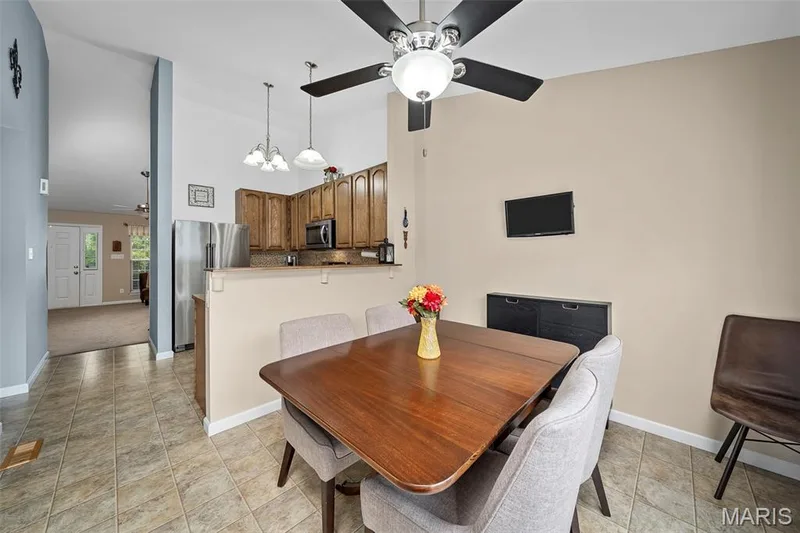 Breakfast room with lighted ceiling fan. — 17 Belmonte Court, Lake St. Louis, MO 63368