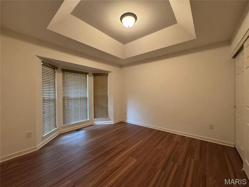 Bedroom 2 with tray ceiling and bay window — 32 Austin Hill Court, Wentzville, MO 63385