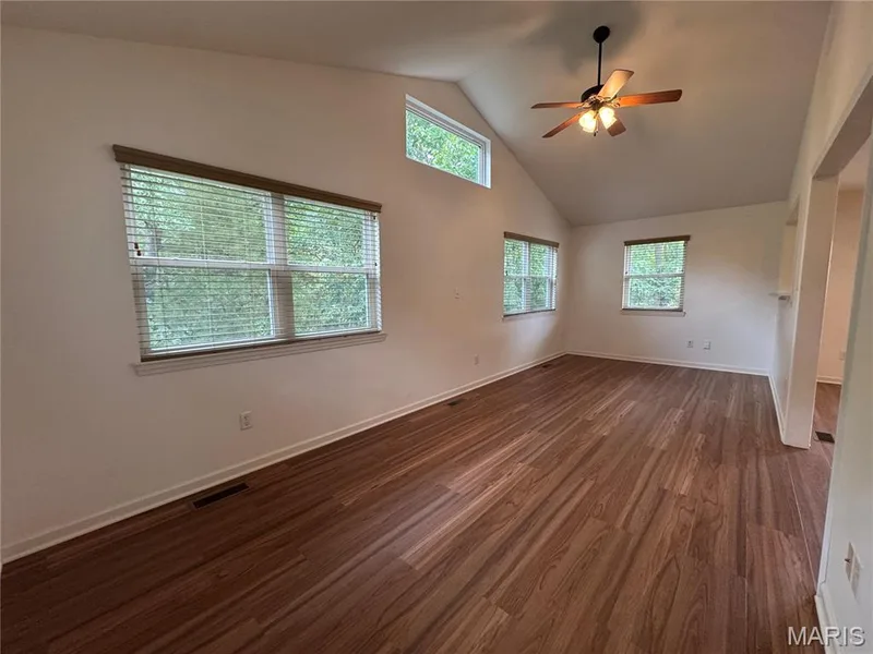 Another view of the Main Floor Bonus Room with vaulted ceiling — 32 Austin Hill Court, Wentzville, MO 63385