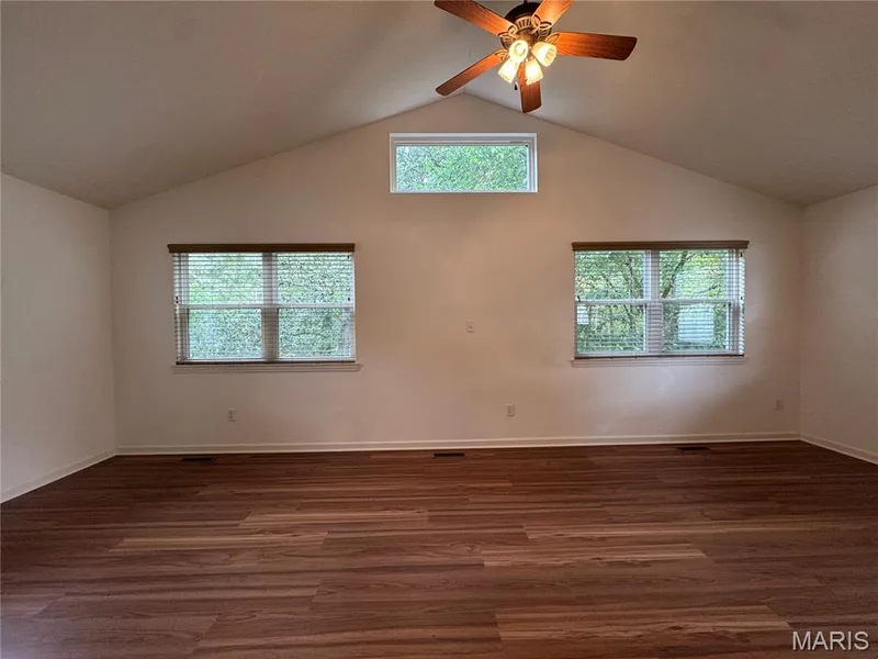Main Floor Bonus Room with vaulted ceiling and MANY windows — 32 Austin Hill Court, Wentzville, MO 63385