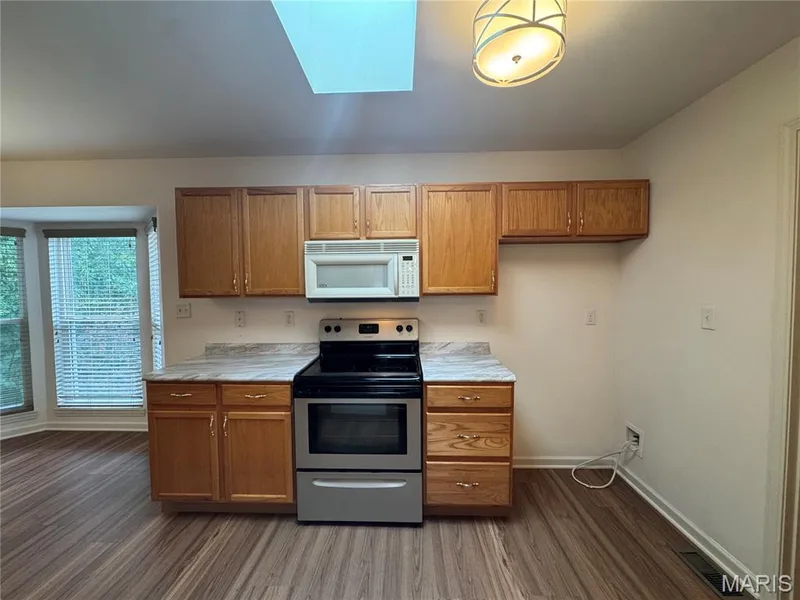 Another view of the kitchen with skylight! — 32 Austin Hill Court, Wentzville, MO 63385