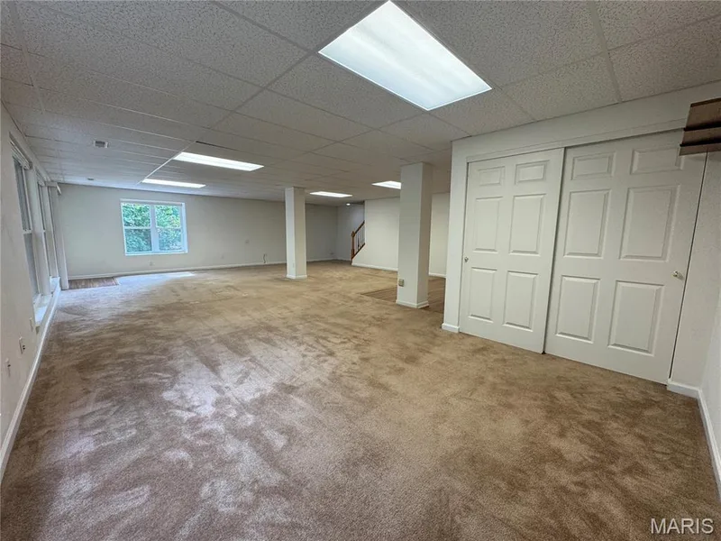 Another view of the finished lower level. This area with closet could easily be made into Bedroom #3 — 32 Austin Hill Court, Wentzville, MO 63385